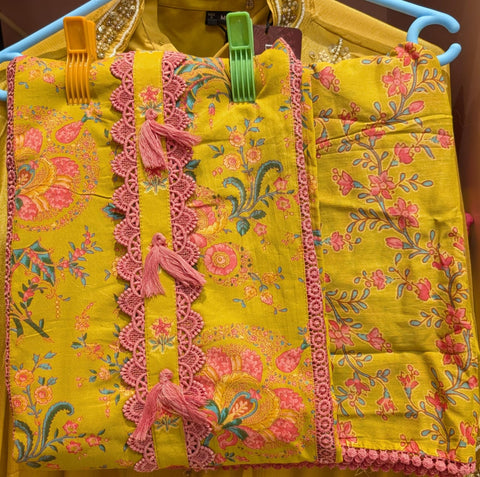 Mustard Yellow Floral Cotton Dress Material with Pink Crochet Lace & Tassel Detailing