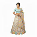 Colorful embroidered fabric with a focus on intricate patterns and vibrant colors.