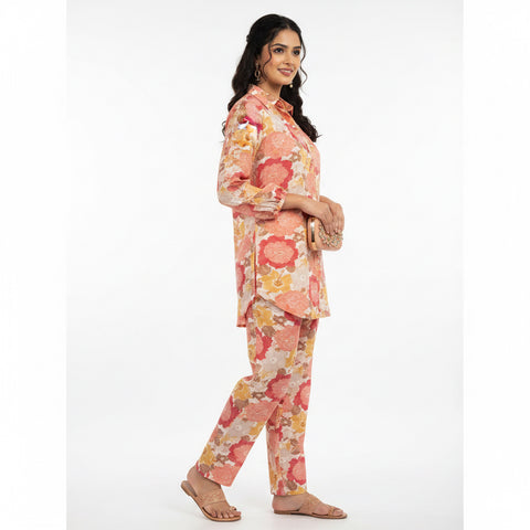 Mannequin wearing a floral outfit in a room with a door and wall.